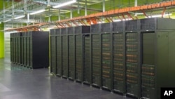 IT specialist Danny Rotscher checks the operating system of the High Performance Computing and Storage Complex II (HRSK-II) during the official opening of the new data center of the Lehmann Center (LZR) of the Dresden University of Technology in Dresden, 