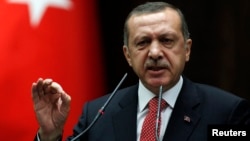 Turkey's Prime Minister Tayyip Erdogan addresses members of parliament from his ruling AK Party (AKP) during a meeting at the Turkish parliament in Ankara June 26, 2012. The Turkish Armed Forces' rules of engagement have changed as a result of Syria shoot