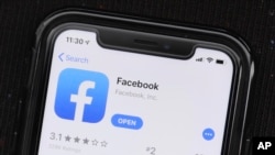 FILE - The social media application, Facebook is displayed on Apple's App Store, July 30, 2019. 