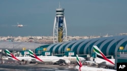 In this file photo, an Emirates jetliner comes in for landing at Dubai International Airport in Dubai, United Arab Emirates, Dec. 11, 2019. (AP Photo/Jon Gambrell, File)