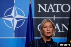 FILE - Belgium's Defense Minister Ludivine Dedonder speaks at a news conference in Madrid, Spain, June 30, 2022.