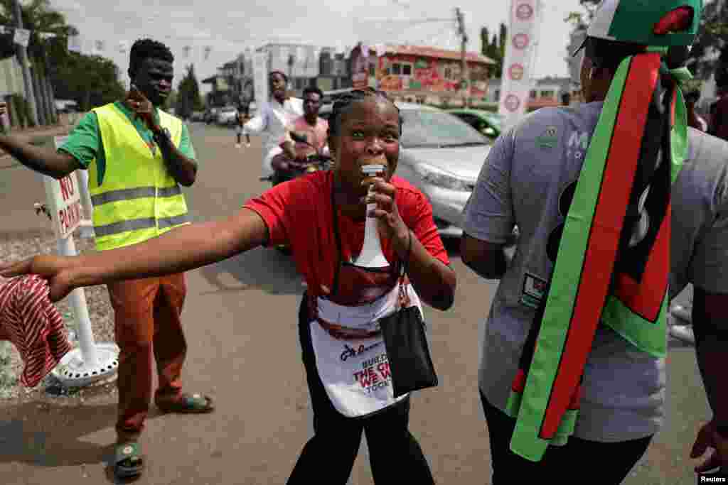 Supporters of Ghana's main opposition National Democratic Congress (NDC) party candidate and former President John Dramani Mahama celebrate his victory after his opponent conceded, in Accra.