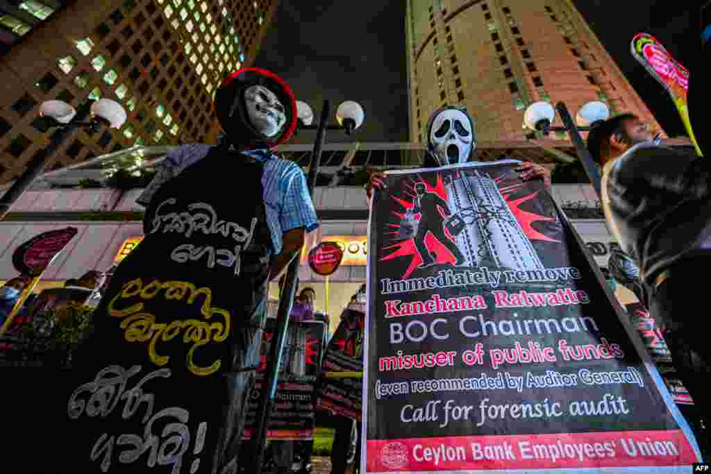Members of Ceylon Bank employees union protest against Bank of Ceylon management outside the Bank of Ceylon headquarters in Sri Lanka's capital Colombo.