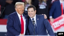 FILE - Former U.S. President Donald Trump greets Senator Marco Rubio, a Republican from Florida, during a campaign rally in Raleigh, North Carolina, on Nov. 4, 2024. Trump announced on Nov. 13, 2024, that he would nominate Rubio to serve as secretary of state.