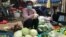 Sok Sreyrath sells produce at Phsar Doeurm Kor market during Cambodia's two-week lockdown, in Phnom Penh, Cambodia, April 15, 2021. (Thida Win/VOA Khmer) 