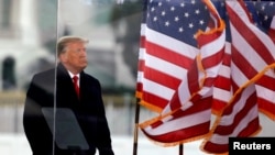 FILE - U.S. President Donald Trump looks on at the end of his speech during a rally to contest the certification of the 2020 U.S. presidential election results by the U.S. Congress, in Washington, Jan. 6, 2021.