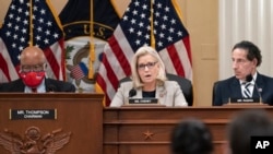 FILE - Rep. Liz Cheney, vice chair of the House panel investigating the Jan. 6 U.S. Capitol insurrection, is flanked by panel chairman, Rep. Bennie Thompson, left, and Rep. Jamie Raskin during a session of the panel at the Capitol in Washington, Dec. 13, 