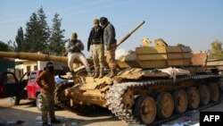 جنگجویان ضد حکومت بشارلاسد، رییس جمهور سوریه، یک تانک نیرو‌های حکومت آن کشور را در ساحهٔ زربه به تصرف خود آوردند 