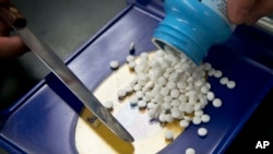 FILE - A prescription is filled at a pharmacy in Sacramento, Calif. On Friday, May 11 2018, Trump is scheduled to give his first speech on how his administration will seek to lower drug prices. 