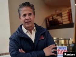 U.S. Rep. Mike Bishop, R-Rochester, who is running for re-election representing Michigan's 8th District, attends an event at his campaign office in Rochester Hills, Michigan, April 14, 2018.