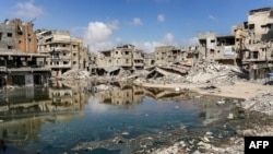 གྷ་ཛཱའི་ལྷོ་ཕྱོགས་ས་ཁུལ་ཁཱན་ཡུ་ནེ་སི་གྲོང་ཁྱེར་གྱི་ཁང་པ་མང་པོ་ཞིག་གཏོར་བཤིག་བཏང་བ་རེད། 