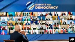 President Joe Biden speaks from the South Court Auditorium on the White House complex in Washington, Thursday, Dec. 9, 2021, for the opening of the Democracy Summit.