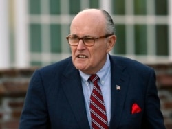FILE - Former New York Mayor Rudy Giuliani arrives at the Trump National Golf Club Bedminster clubhouse in Bedminster, N.J., Nov. 20, 2016.