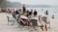 Chinese tourists relaxing at Ochheuteal Beach in Sihanoukville province, Cambodia, February 13, 2019. (Aun Chhengpor/VOA Khmer)