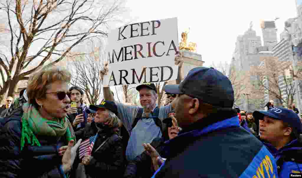 A man holds an anti-gun control sign during a "March For Our Lives" demonstration in New York, March 24, 2018.