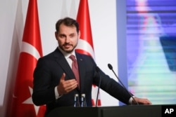 FILE - Berat Albayrak, Turkey's Treasury and Finance Minister, talks during a conference in Istanbul, Aug. 10, 2018, in a bid to ease investor concerns about Turkey's economic policy.