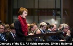 FILE - The Agent of Ukraine, Olena Zerkal, speaks on opening day of hearings in the case of Ukraine v. Russian Federation at the International Court of Justice, The Hague, March 6, 2017.