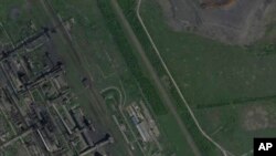 Satelitski snimak od 20. maja 2021. prikazuje koksaru Avdiivka prije invazije Rusije na Ukrajinu. Gubitak grada Avdiivka u februaru 2024. označio je kraj duge, iscrpljujuće odbrane ukrajinske vojske. (Planet Labs preko AP)