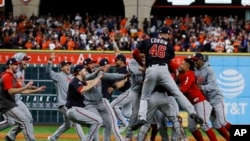 The Washington Nationals celebrate after Game 7 of the baseball World Series against the Houston Astros Wednesday, Oct. 30, 2019, in Houston. The Nationals won 6-2 to win the series. (AP Photo/Matt Slocum)