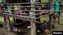 Villagers who fled Myanmar's Ee Thu Hta displacement camp rest in Mae Hong Son province, Thailand, near the border while fleeing from gunfire between ethnic minority Karen insurgents and Myanmar military, April 29, 2021.