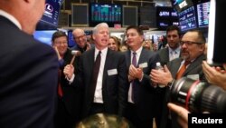 FILE - Liberty Oilfield Services Inc. CEO Chris Wright, center, rings a ceremonial bell to celebrate the companies IPO on the floor of the New York Stock Exchange, Jan. 12, 2018. President-elect Donald Trump has selected, Nov. 16, 2024, Wright to lead the Energy Department.