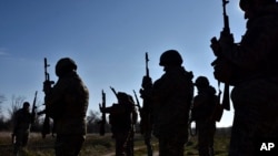 Ukrainian soldiers attend a training in Zaporizhzhia region, Ukraine, in this provided by the Ukraine's 65th Mechanised Brigade press service on Nov. 19, 2024.