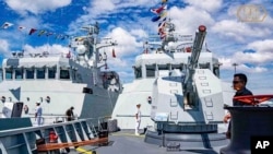 កងទ័ពជើងទឹក​រាម​កំពុង​យាមល្បាត​​មូលដ្ឋាន​កង​ទ័ព​ជើង​ទឹក​រាម​ក្នុង​ខេត្ត​ព្រះសីហនុ ប្រទេស​កម្ពុជា​កាលពីថ្ងៃទី​៣ ធ្នូ ឆ្នាំ២០២៣។(Ream Naval Base's Facebook page via AP)