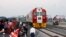 FILE - Kenyan President Uhuru Kenyatta (3rd-L) watches the opening of the SGR cargo train as it leaves the port containers depot in Mombasa to Nairobi, May 30, 2017. The project, a $3.3 billion investment backed by China, is the country's largest infrastr