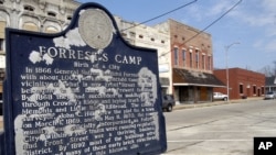 FILE - A plaque describing the origins of the city is seen in Forrest City, Arkansas, Feb. 27, 2009.