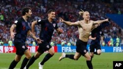 Croatia's Domagoj Vida, right, celebrates with his teammates after scoring his side's second goalduring the quarterfinal match between Russia and Croatia at the 2018 soccer World Cup.