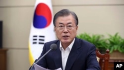 South Korean President Moon Jae-in speaks during a meeting with his senior aides at the presidential Blue House in Seoul, South Korea, Monday, Aug. 5, 2019. 
