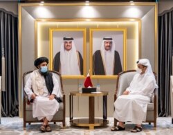 Qatar's Deputy Prime Minister and Minister of Foreign Affairs Mohammed bin Abdulrahman Al Thani meets with Mullah Abdul Ghani Baradar, head of the Taliban's political bureau, in Doha, Qatar, August 17, 2021.