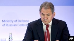 FILE - Russian Defense Minister Sergei Shoigu listens during a security conference in Moscow, May 23, 2014. 