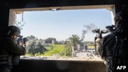 Tentara Israel beroperasi di Jalur Gaza di tengah pertempuran yang sedang berlangsung antara Israel dan kelompok militan Palestina Hamas, 23 Januari 2024. (Tentara Israel / AFP)