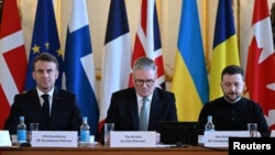 France's President Emmanuel Macron, Britain's Prime Minister Keir Starmer and Ukraine's President Volodymyr Zelenskyy prepare to hold a plenary meeting at a summit held at Lancaster House in central London on March 2, 2025. 