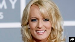 FILE - Stormy Daniels arrives for the 49th Annual Grammy Awards in Los Angeles, Feb. 11, 2007. 