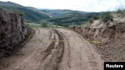 View of a dirt road passing through a damaged section of the Great Wall of China, in Youyu County, Shuozhou City, Shanxi Province, China, in this still image released on August 31, 2023. (Youyu County Public Security Bureau/Handout via REUTERS)