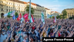 FILE - Demonstrators take part in an anti-government protest in Budapest, June 5, 2021, to demonstrate against the right-wing Fidesz party of Prime Minister Viktor Orban.