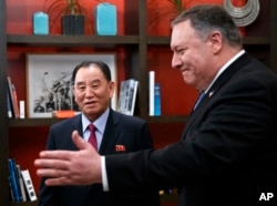 Secretary of State Mike Pompeo, right, and Kim Yong Chol, a North Korean senior ruling party official and former intelligence chief, walk from a photo opportunity at the The Dupont Circle Hotel in Washington, Jan. 18, 2019.