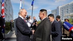 FILE PHOTO: North Korean leader Kim Jong Un meets Russia's President Vladimir Putin