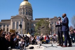U.S. Sens. Jon Ossoff, D-Ga., and Raphael Warnock, D-Ga., speak during a "Stop Asian hate" rally outside the Georgia Capitol in Atlanta, March 20, 2021.
