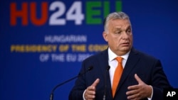 FILE - Hungary's Prime Minister Viktor Orban addresses a media conference at the end of an EU Summit at the Puskas Arena in Budapest, Nov. 8, 2024. 