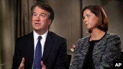 Brett Kavanaugh, with his wife Ashley Estes Kavanaugh, answers questions during a FOX News interview, Sept. 24, 2018, in Washington, about allegations of sexual misconduct against the Supreme Court nominee. 