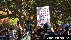 Signs supporting a planned speech by Milo Yiannopoulos in Berkeley, California on Sunday, Sept. 24, 2017 following a protest of another speech of his at the University of California, Berkeley earlier that year.