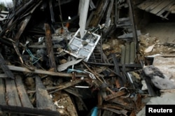 Debris of a destroyed house is seen near the airport in Donetsk, Ukraine, Oct. 25, 2017.