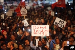 Asylum-seekers protest against deportation in Tel Aviv, Israel, Feb. 24, 2018.