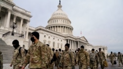 Members of the National Guard arrive to the U.S. Capitol days after supporters of U.S. President Donald Trump stormed the Capitol in Washington, U.S. January 11, 2021. REUTERS/Erin Scott