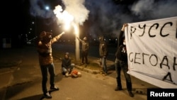 Protesters take part in a rally against Russian plans to hold parliamentary elections in annexed Crimea, near the Russian embassy in Kyiv, Ukraine, Sept. 17, 2016.