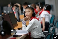 In this June 16, 2017, photo, North Korean students use computer terminals at the Sci-Tech Complex in Pyongyang, North Korea.