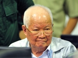 In this photo released by the Extraordinary Chambers in the Courts of Cambodia, Khieu Samphan, former Khmer Rouge head of state, sits in a court room before a hearing at the U.N.-backed war crimes tribunal in Phnom Penh, Cambodia, Friday, Nov. 16, 2018.